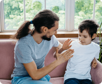 man and boy having a highfive