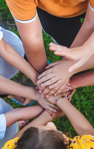 Children are playing with their hands clasped together